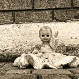 vintage blackandwhite doll dolls creepy oldphoto wall bricks